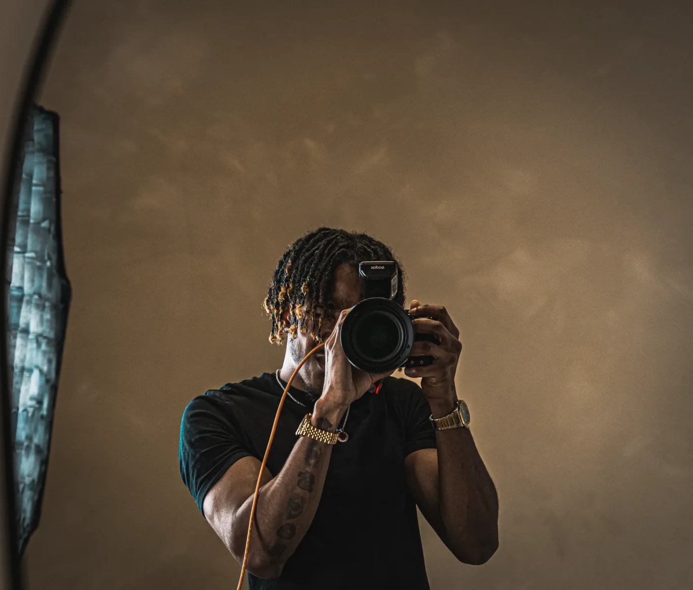 TJ, the photographer behind TJMONEYY MEDIA, in London